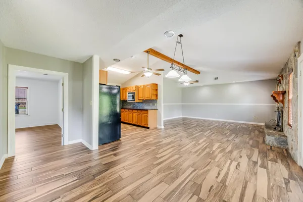 a view of empty room and wooden floor