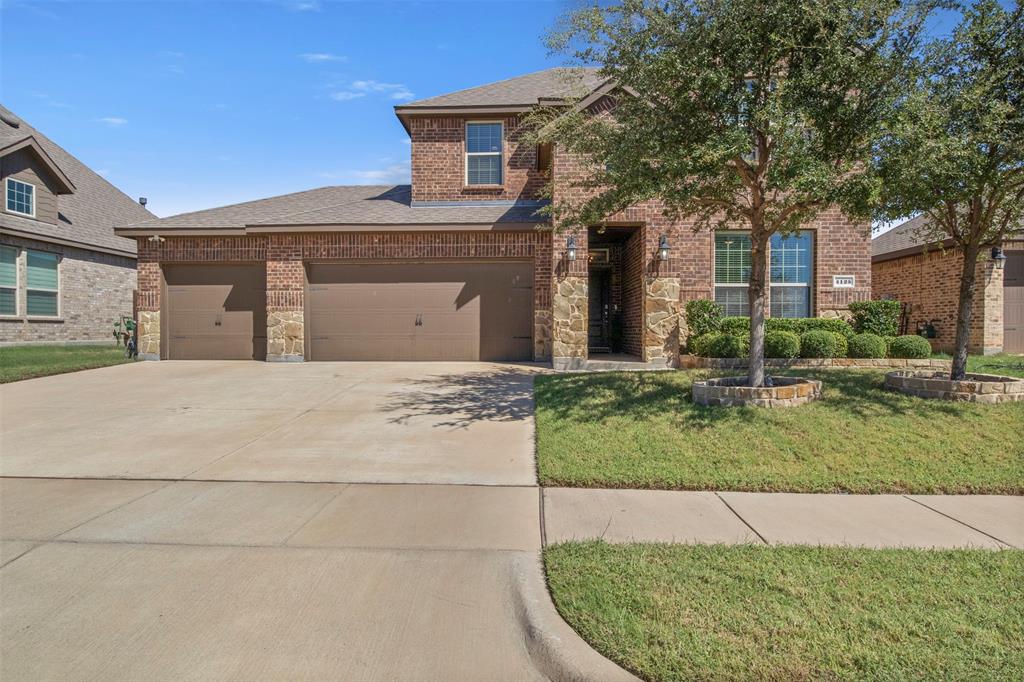 4125 Fern Loop Forney, TX 75126 - Photo 1 of 40 Brick and stone exterior with a two-story design