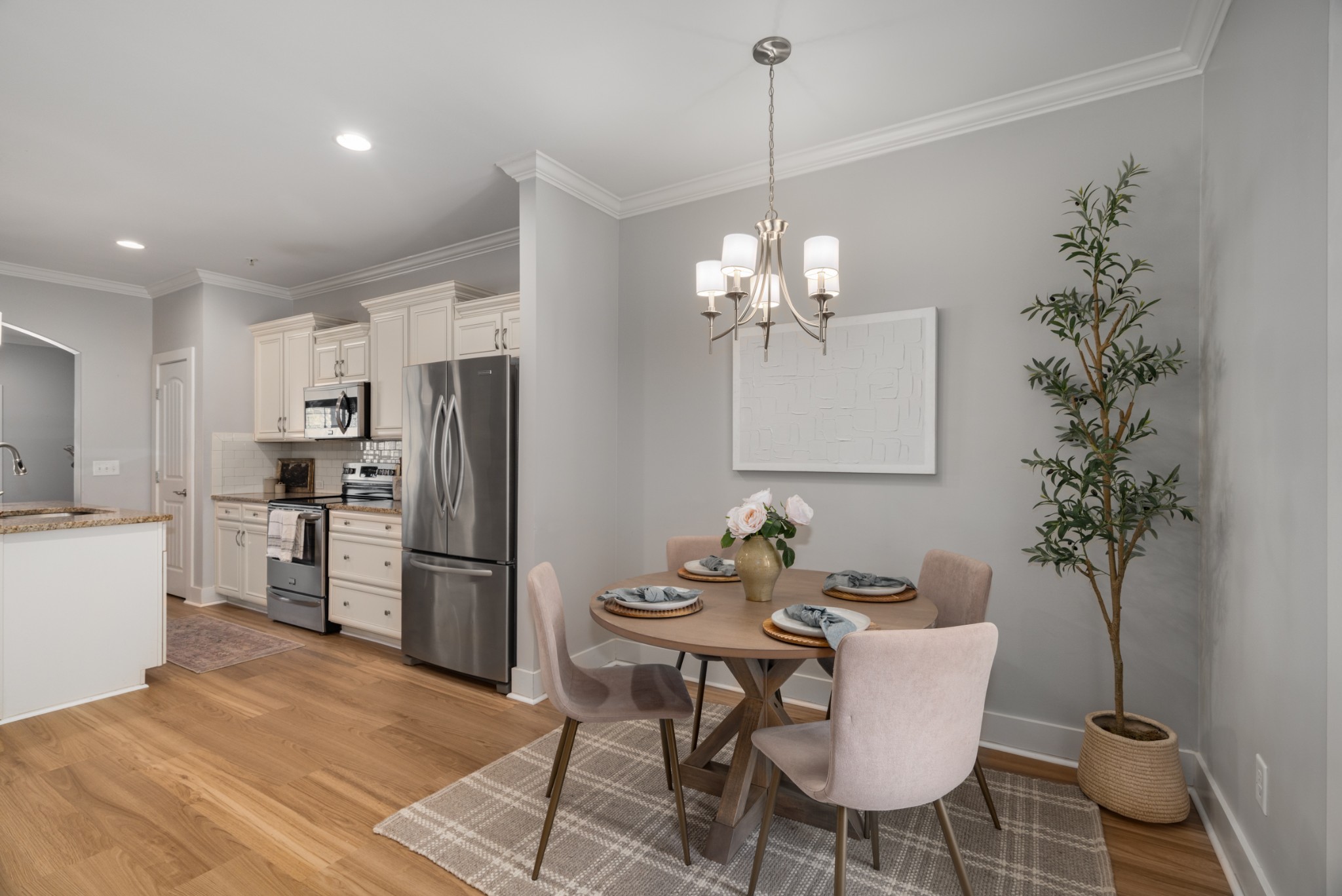 4021 Viola Lane Franklin, TN 37069 - Photo 17 of 34 a dining room with furniture a chandelier and wooden floor
