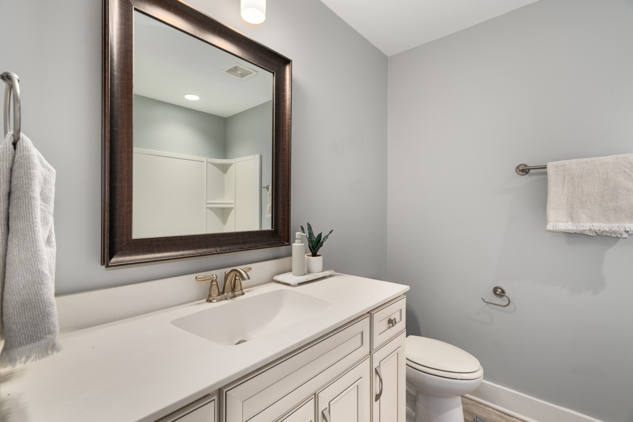 4021 Viola Lane Franklin, TN 37069 - Photo 24 of 34 a bathroom with a sink toilet vanity and mirror
