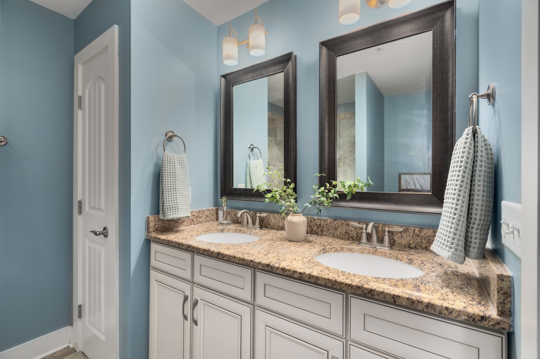 4021 Viola Lane Franklin, TN 37069 - Photo 25 of 34 a bathroom with a sink and a mirror