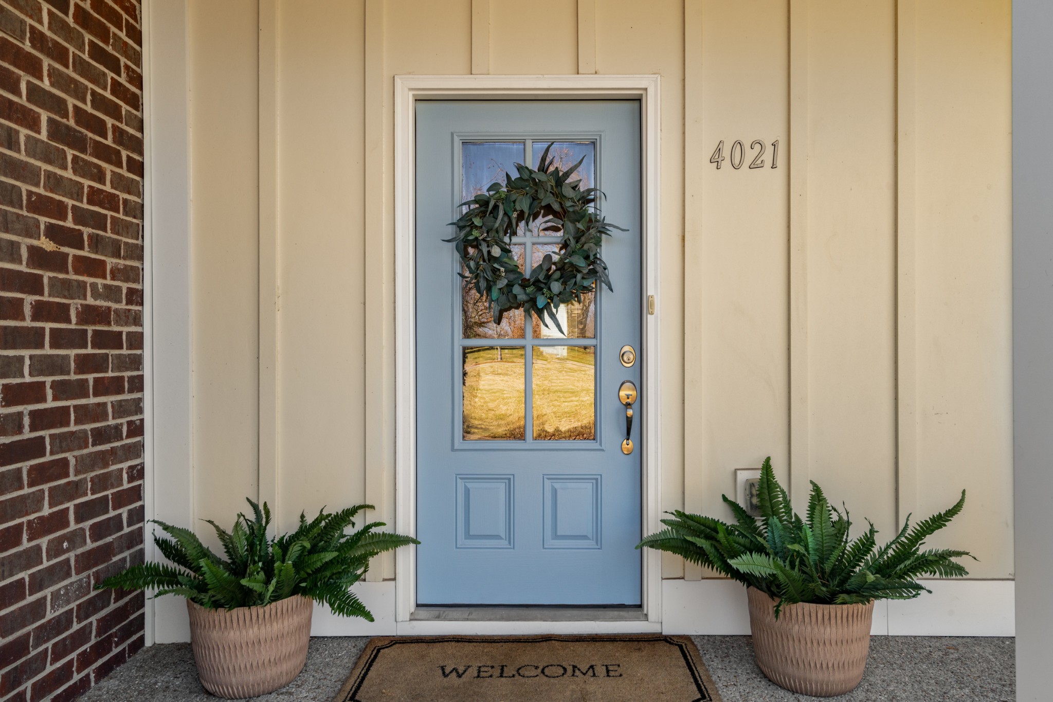 4021 Viola Lane Franklin, TN 37069 - Photo 6 of 34 a potted plant sitting in front of a door