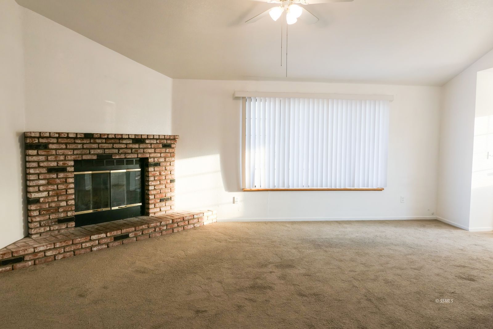 322 Reese Street Ridgecrest, CA 93555 - Photo 4 of 35 an empty room with fireplace