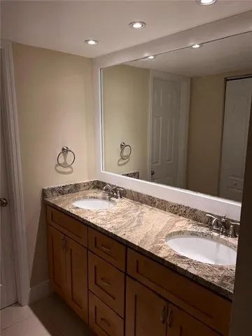 a view of a kitchen island with a sink