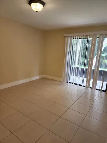 a view of a floor and television in the back yard