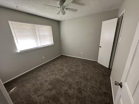 4408 Chicago Avenue Lubbock, TX 79414 - Photo 14 of 19 an empty room with a window and a fan