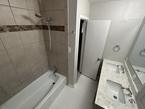 4408 Chicago Avenue Lubbock, TX 79414 - Photo 15 of 19 a bathroom with a tub a sink and a shower