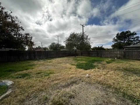 a view of backyard with trampoline