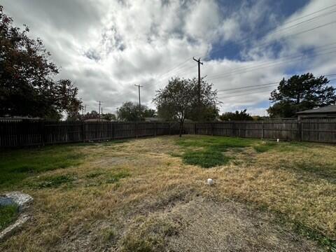 4408 Chicago Avenue Lubbock, TX 79414 - Photo 18 of 19 a view of backyard with trampoline
