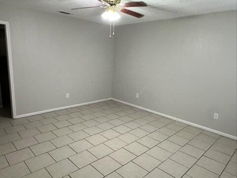 4408 Chicago Avenue Lubbock, TX 79414 - Photo 2 of 19 en empty room with fan