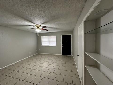 4408 Chicago Avenue Lubbock, TX 79414 - Photo 4 of 19 a view of an empty room with a window