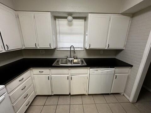 4408 Chicago Avenue Lubbock, TX 79414 - Photo 8 of 19 a kitchen with white cabinets and white appliances