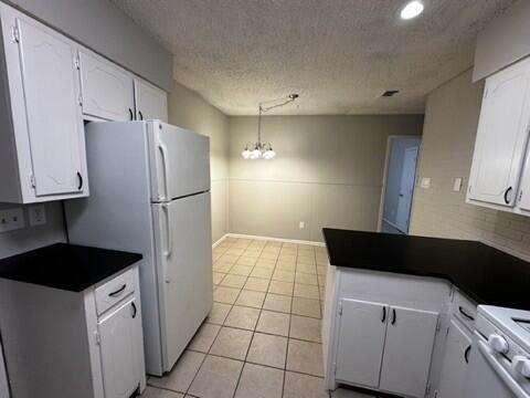4408 Chicago Avenue Lubbock, TX 79414 - Photo 9 of 19 a kitchen with a refrigerator and a stove