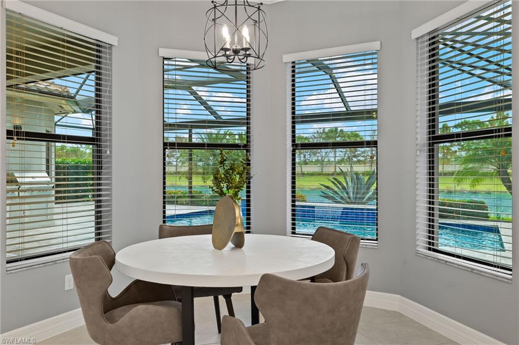 4398 Caldera Circle Naples, FL 34119 - Photo 16 of 50 a view of a dining room with furniture window and outside view