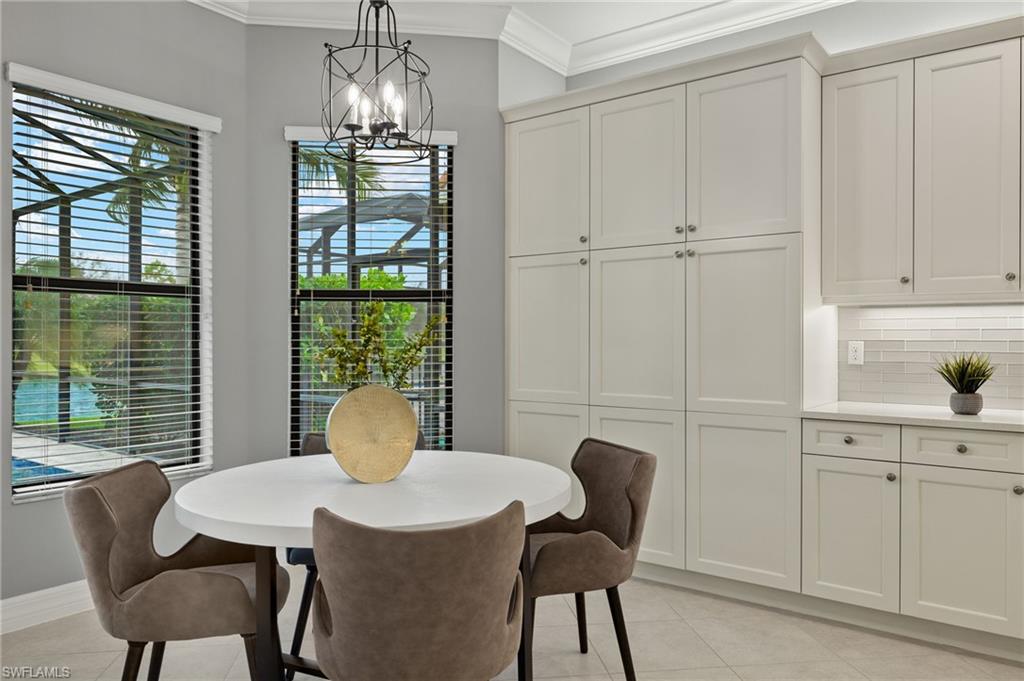 4398 Caldera Circle Naples, FL 34119 - Photo 17 of 50 a view of a dining room with furniture window and outside view