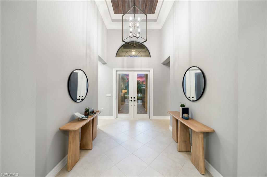 4398 Caldera Circle Naples, FL 34119 - Photo 23 of 50 a bathroom with a toilet a mirror and vanity
