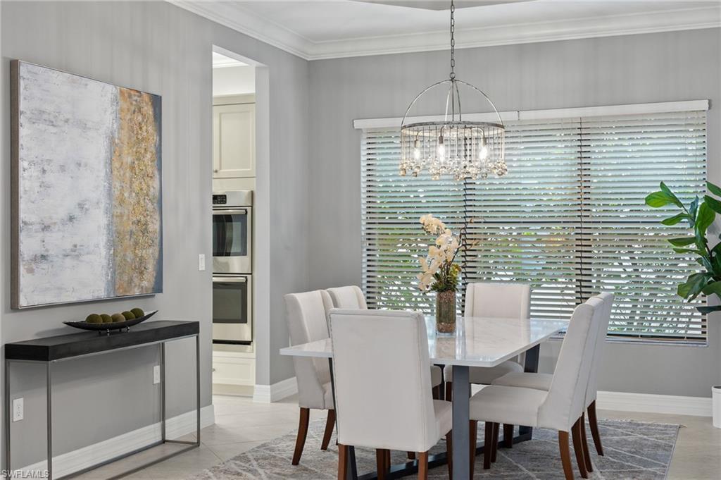 4398 Caldera Circle Naples, FL 34119 - Photo 25 of 50 a view of a dining room with furniture and window