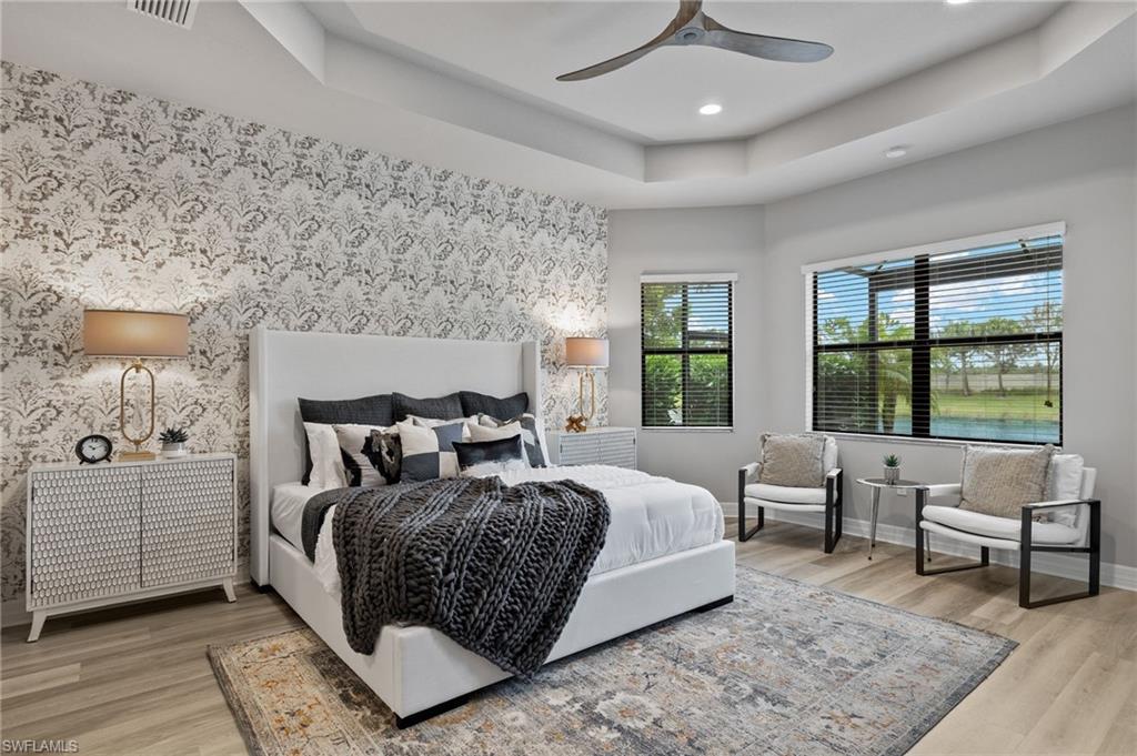 4398 Caldera Circle Naples, FL 34119 - Photo 28 of 50 a bedroom with a large bed and a window