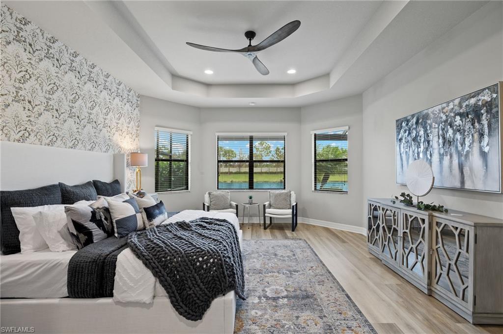 4398 Caldera Circle Naples, FL 34119 - Photo 29 of 50 a large bedroom with furniture and windows
