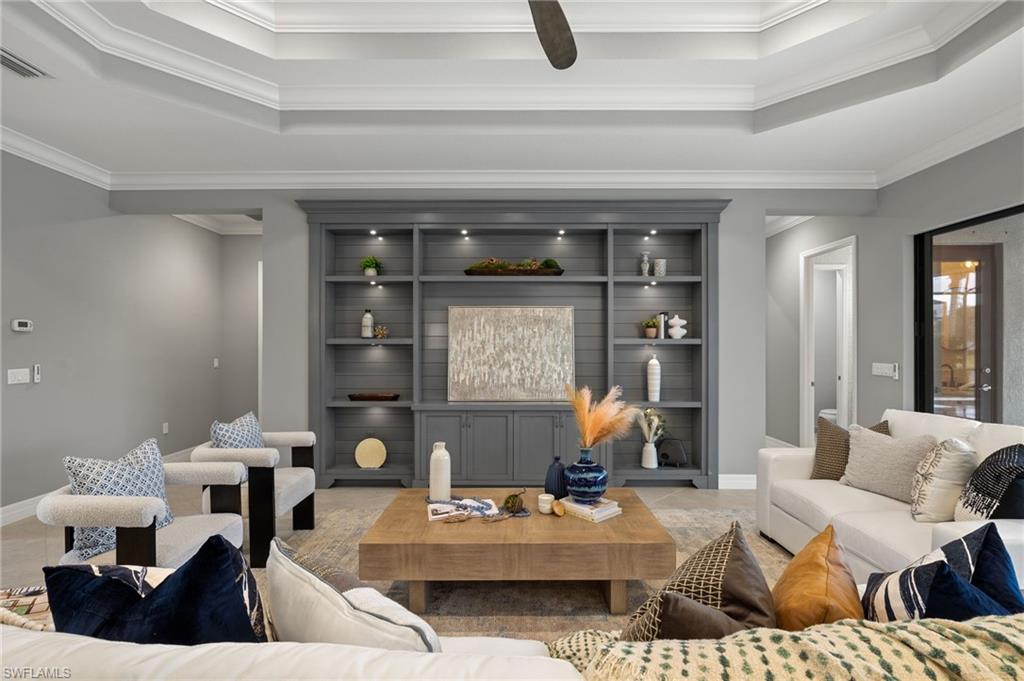 4398 Caldera Circle Naples, FL 34119 - Photo 3 of 50 a living room with furniture and window