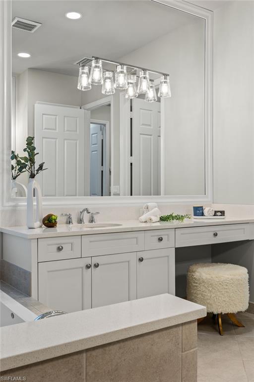 4398 Caldera Circle Naples, FL 34119 - Photo 33 of 50 a spacious bathroom with a double vanity sink mirror and