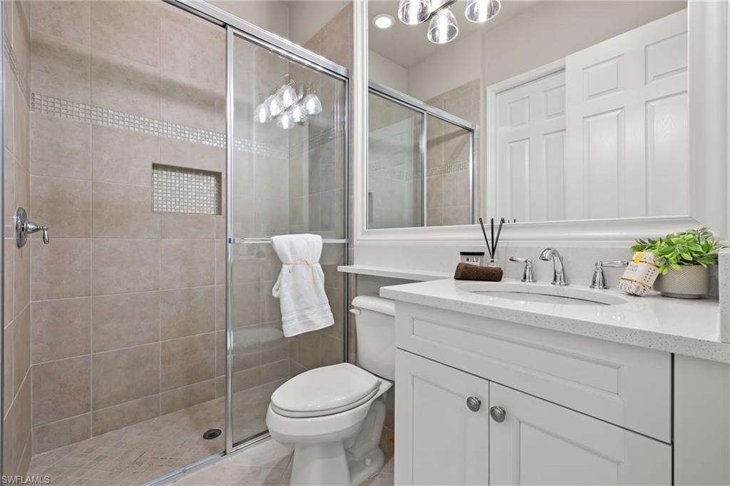 4398 Caldera Circle Naples, FL 34119 - Photo 37 of 50 a bathroom with a sink a toilet and shower