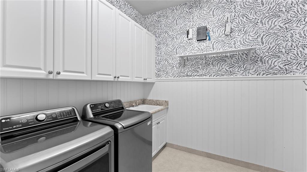 4398 Caldera Circle Naples, FL 34119 - Photo 45 of 50 a room with a stove and a microwave