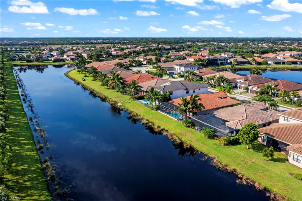 4398 Caldera Circle Naples, FL 34119 - Photo 46 of 50 an aerial view of a house with a lake view