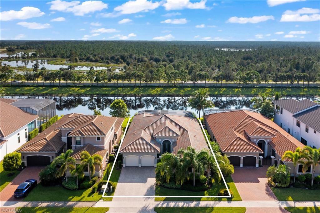 4398 Caldera Circle Naples, FL 34119 - Photo 47 of 50 a view of a city with lawn chairs