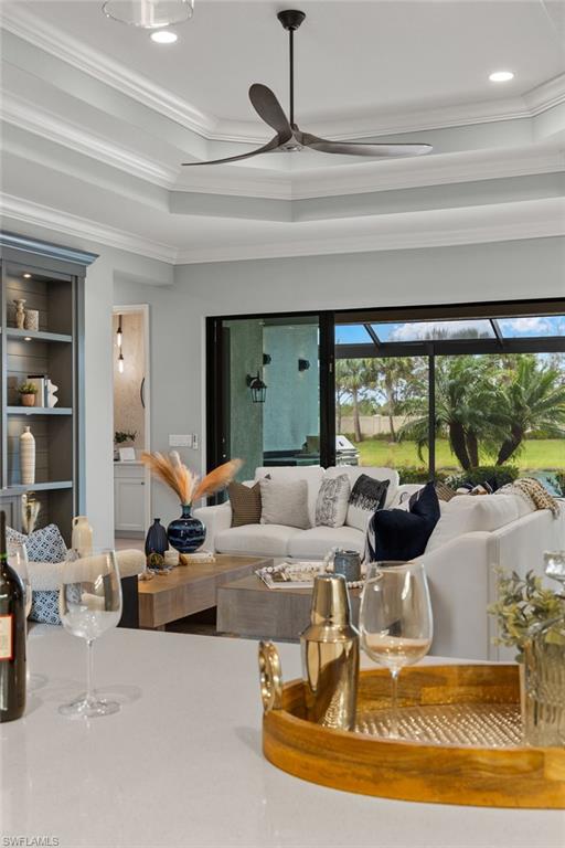 4398 Caldera Circle Naples, FL 34119 - Photo 5 of 50 a living room with furniture and a large window