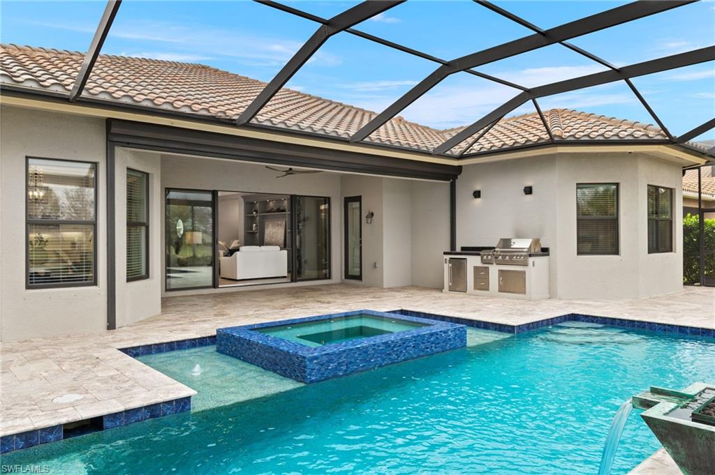 4398 Caldera Circle Naples, FL 34119 - Photo 8 of 50 a view of an house with backyard porch and kitchen