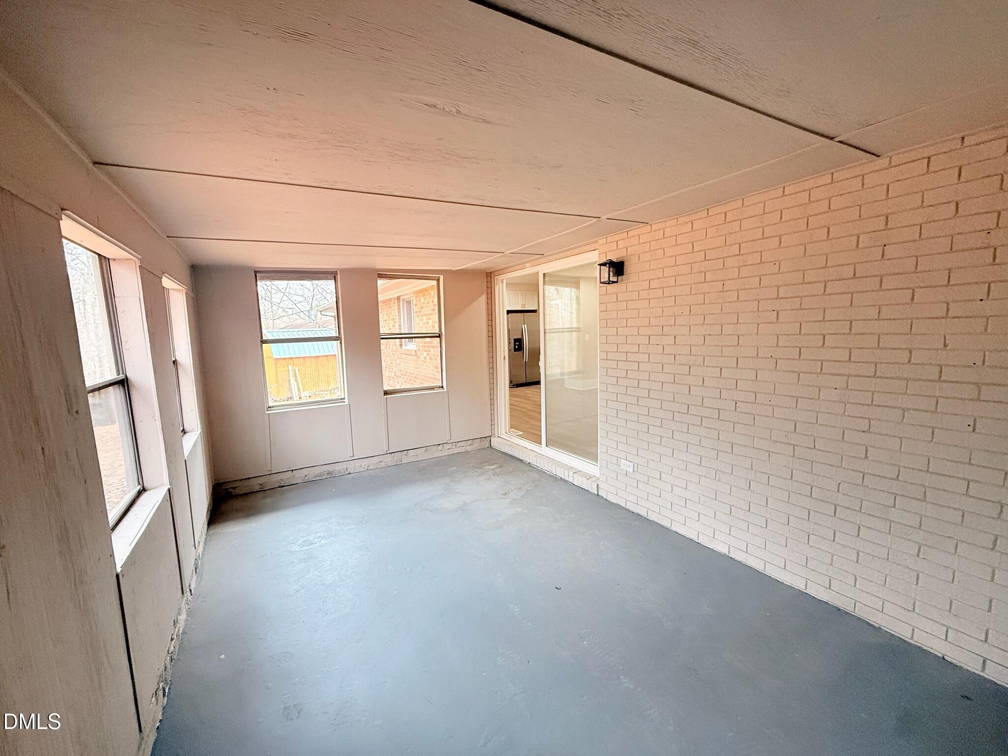 1209 Snow Hill Road Durham, NC 27712 - Photo 12 of 14 a view of empty room with windows