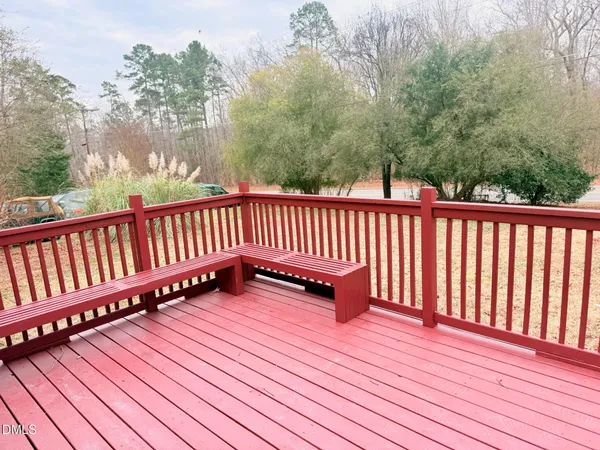 a balcony with wooden floor
