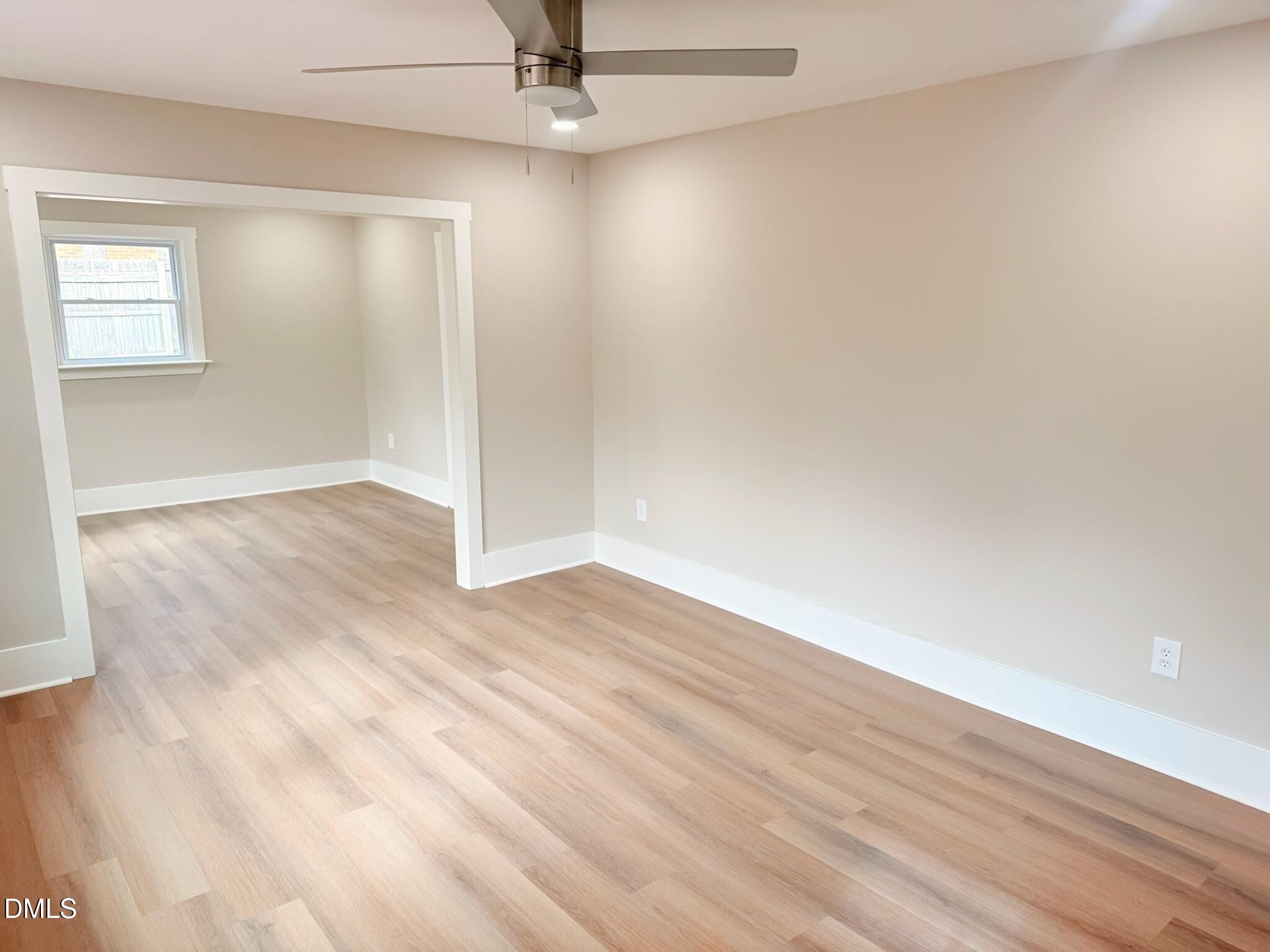1209 Snow Hill Road Durham, NC 27712 - Photo 4 of 14 wooden floor in an empty room with a window