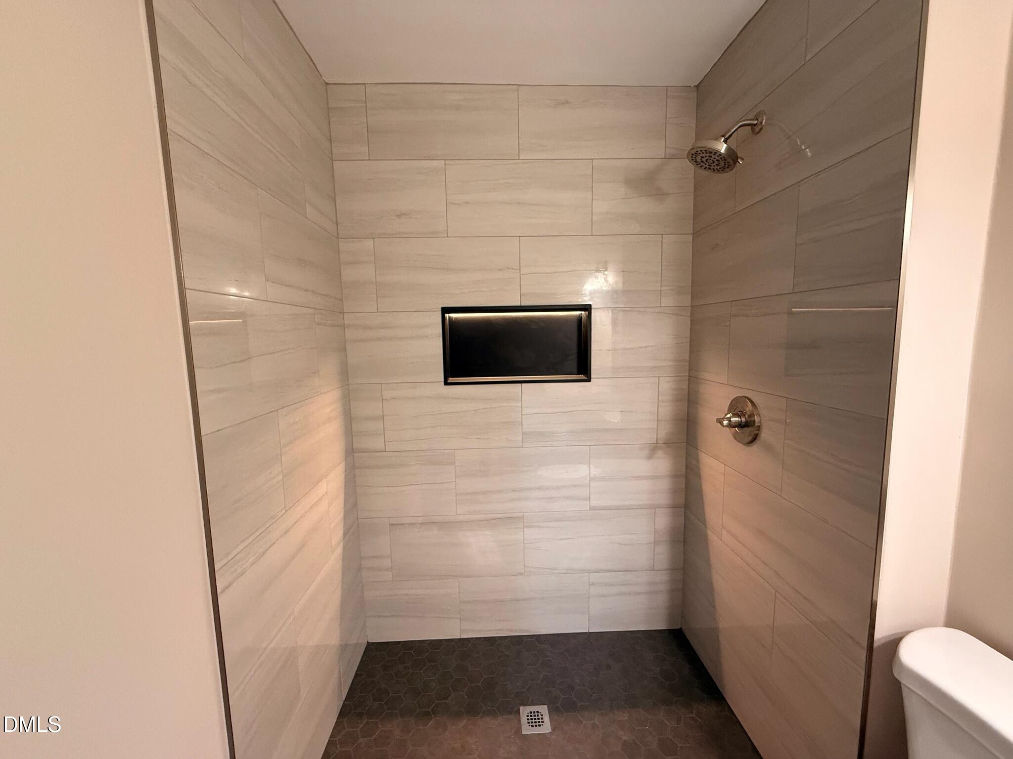 1209 Snow Hill Road Durham, NC 27712 - Photo 10 of 14 a bathroom with a shower