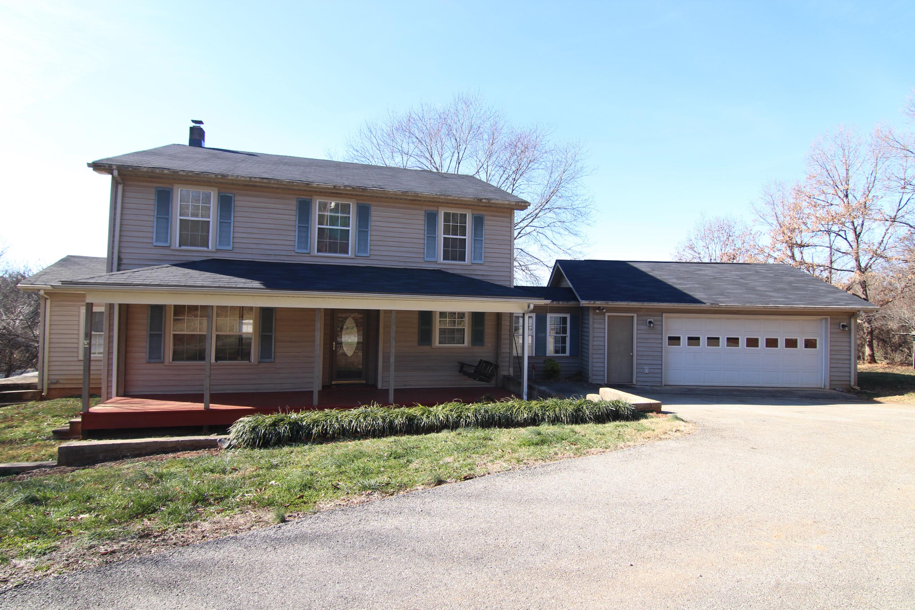 1063 Pep Hill Road Goodview, VA 24095 - Photo 2 of 27 a front view of a house with a garden