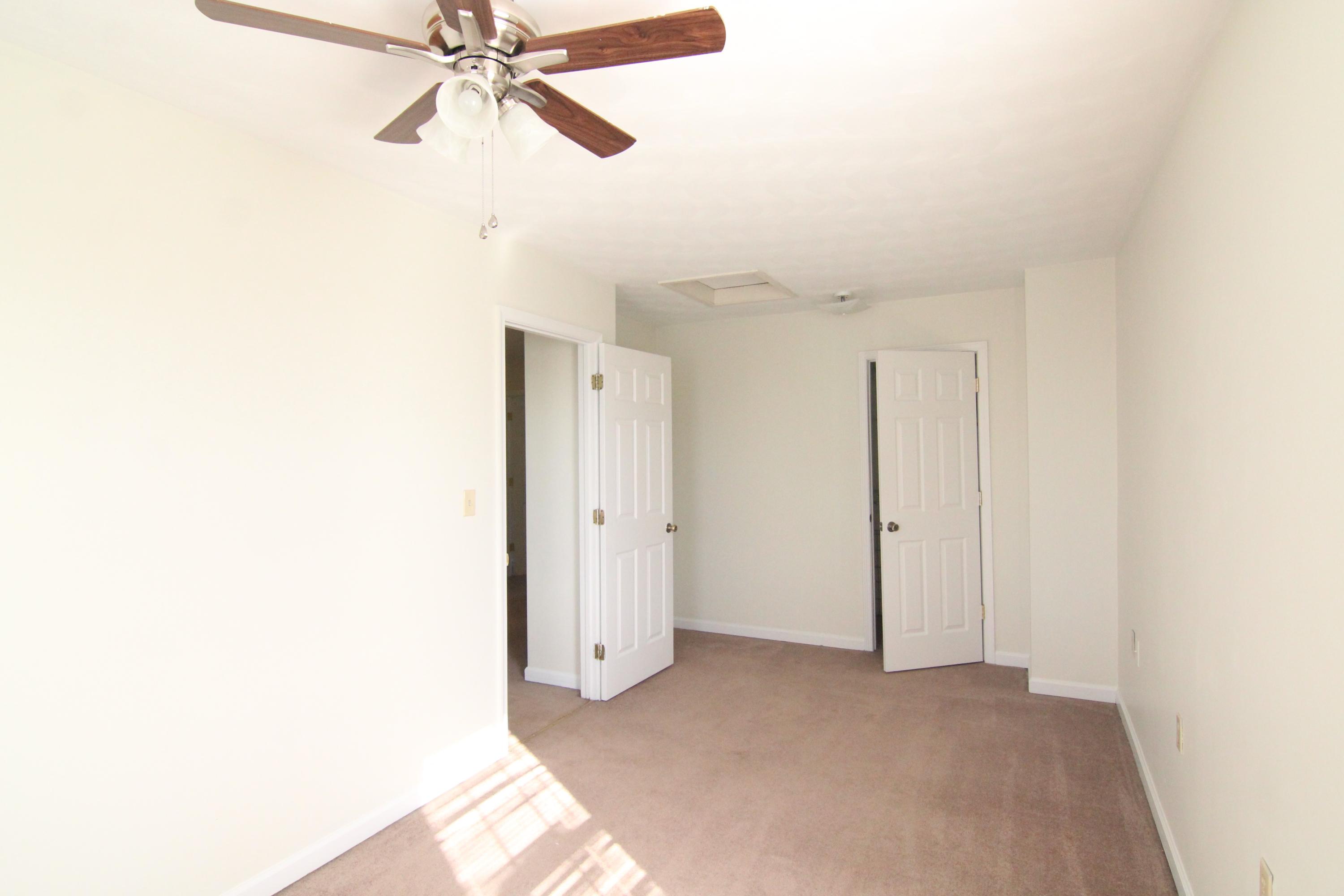 1063 Pep Hill Road Goodview, VA 24095 - Photo 19 of 27 a view of a room with a ceiling fan and a window