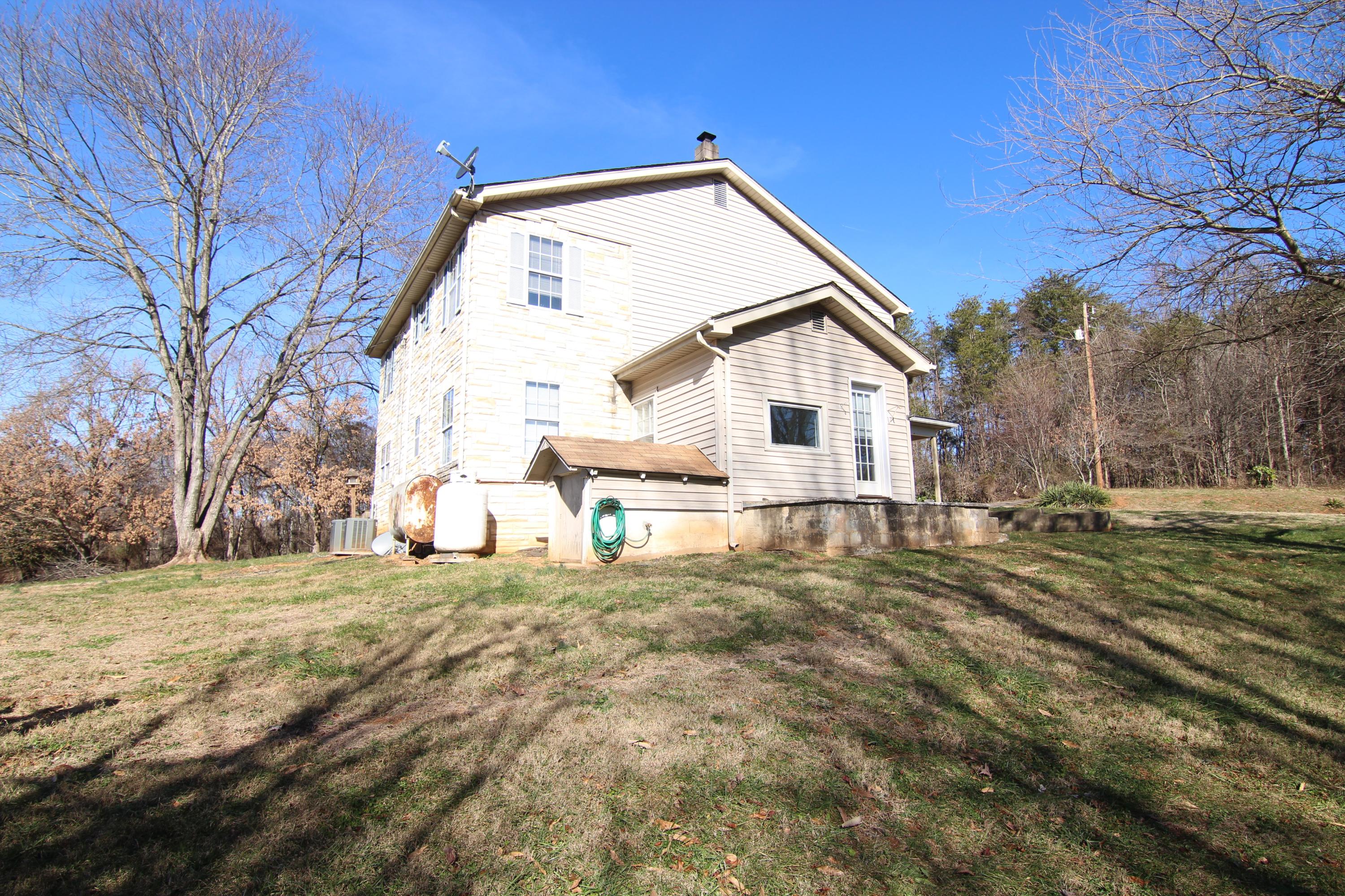 1063 Pep Hill Road Goodview, VA 24095 - Photo 25 of 27 a view of a house with a yard