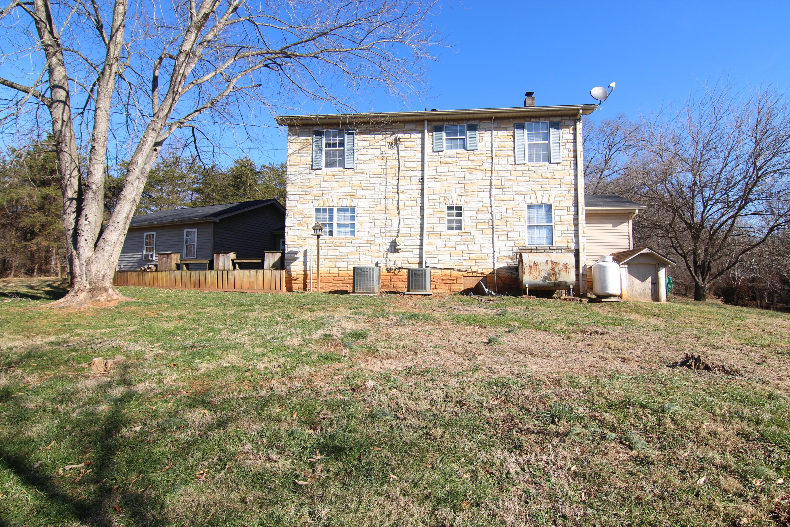 1063 Pep Hill Road Goodview, VA 24095 - Photo 26 of 27 a view of a house with a backyard