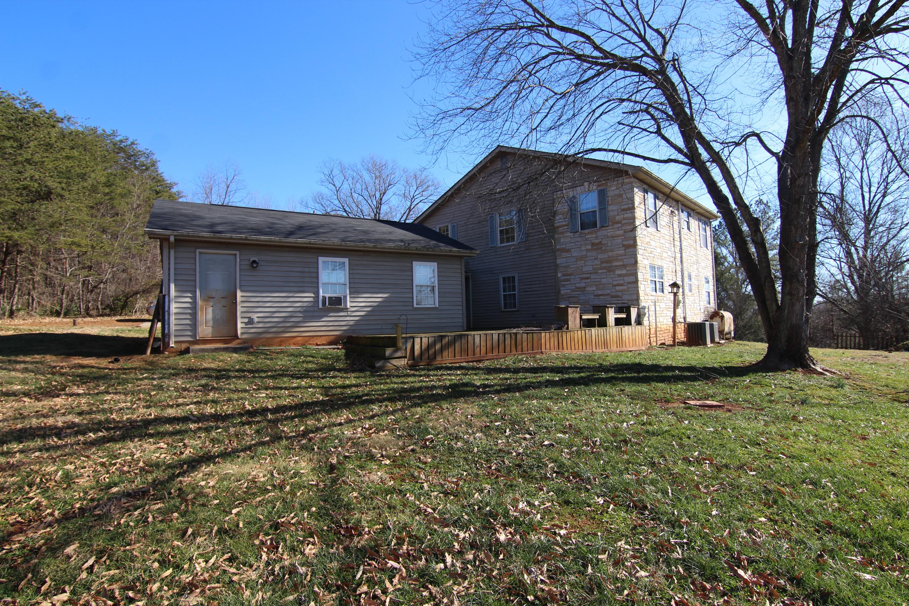 1063 Pep Hill Road Goodview, VA 24095 - Photo 27 of 27 a front view of a house with garden