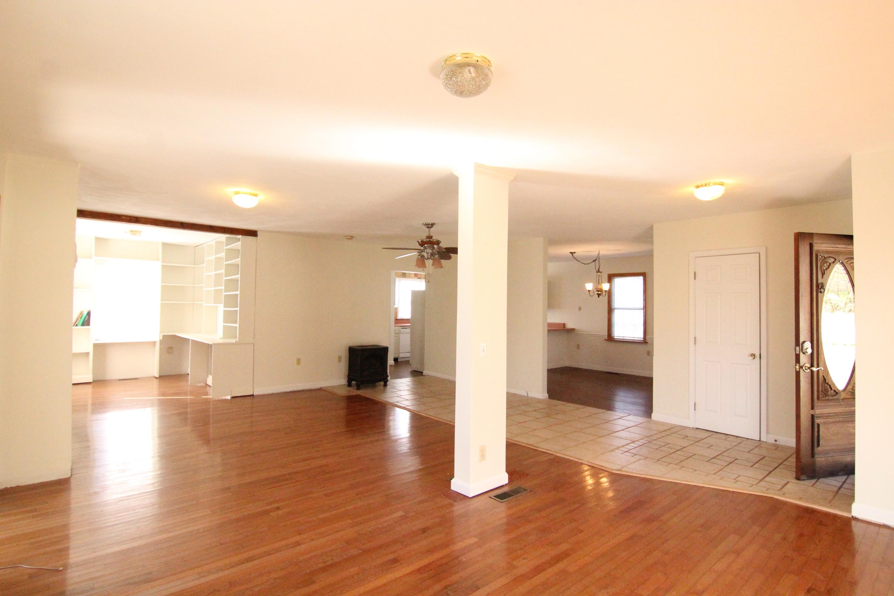 1063 Pep Hill Road Goodview, VA 24095 - Photo 4 of 27 a view of an empty room and wooden floor