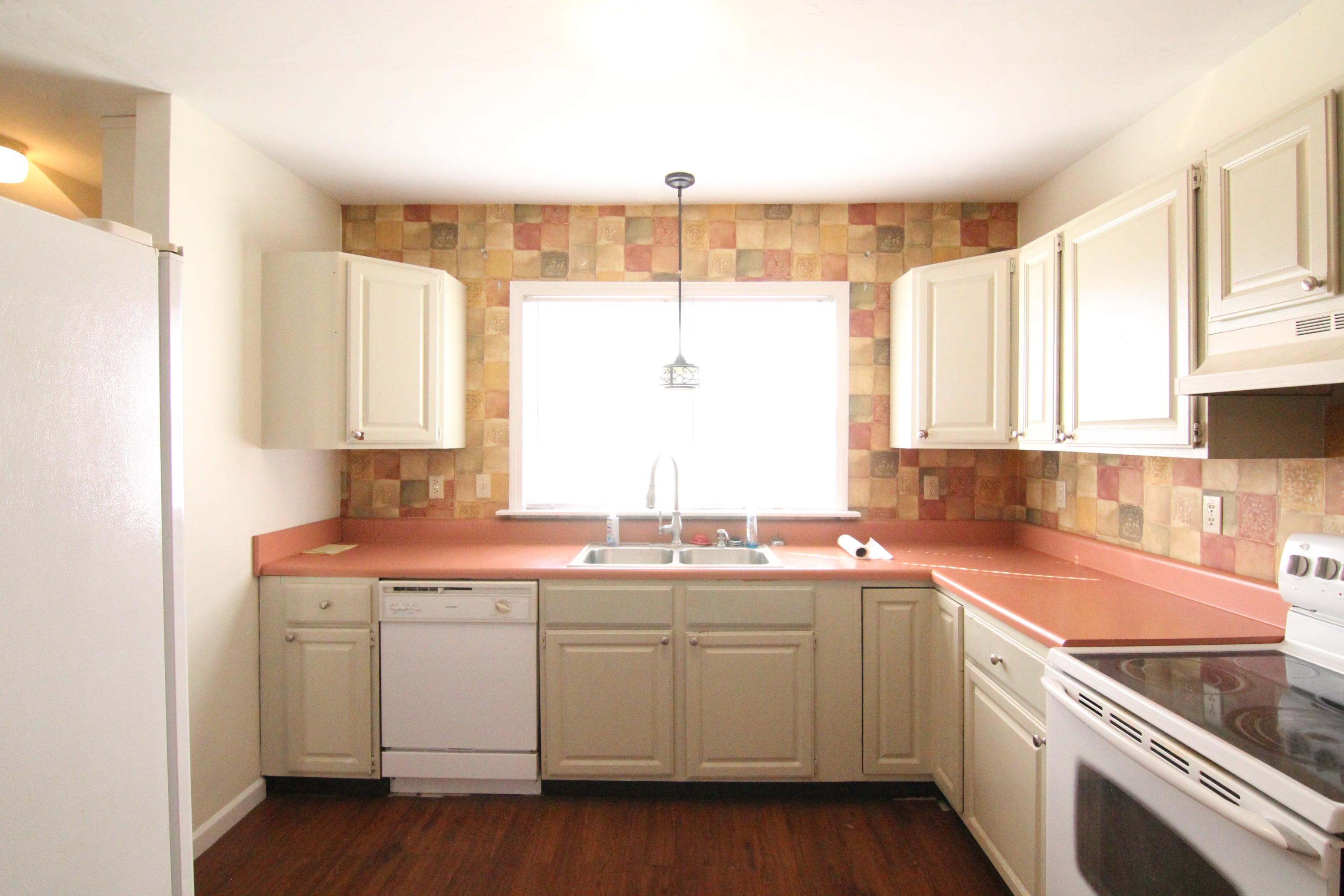 1063 Pep Hill Road Goodview, VA 24095 - Photo 7 of 27 a kitchen with a sink stove and cabinets