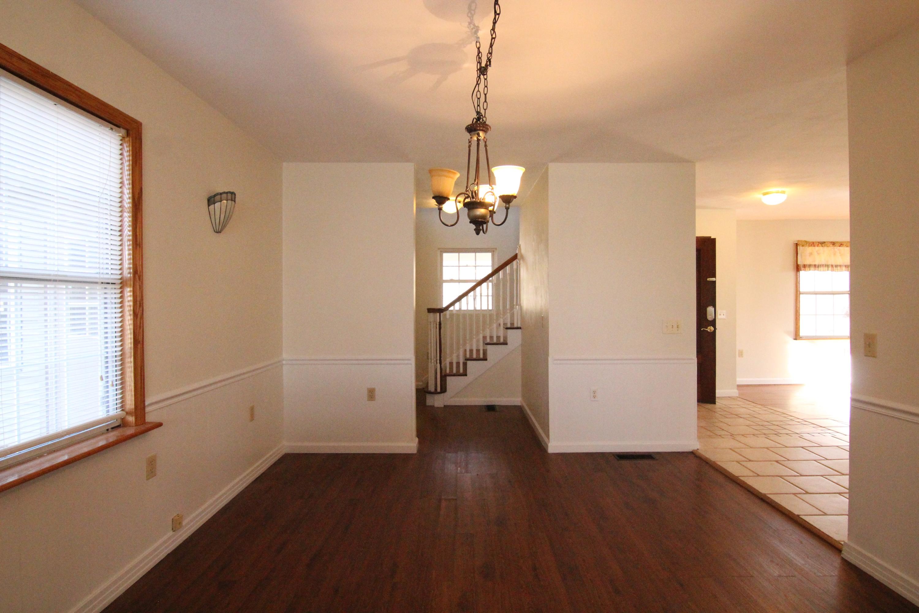 1063 Pep Hill Road Goodview, VA 24095 - Photo 10 of 27 a view of a room with wooden floor and windows