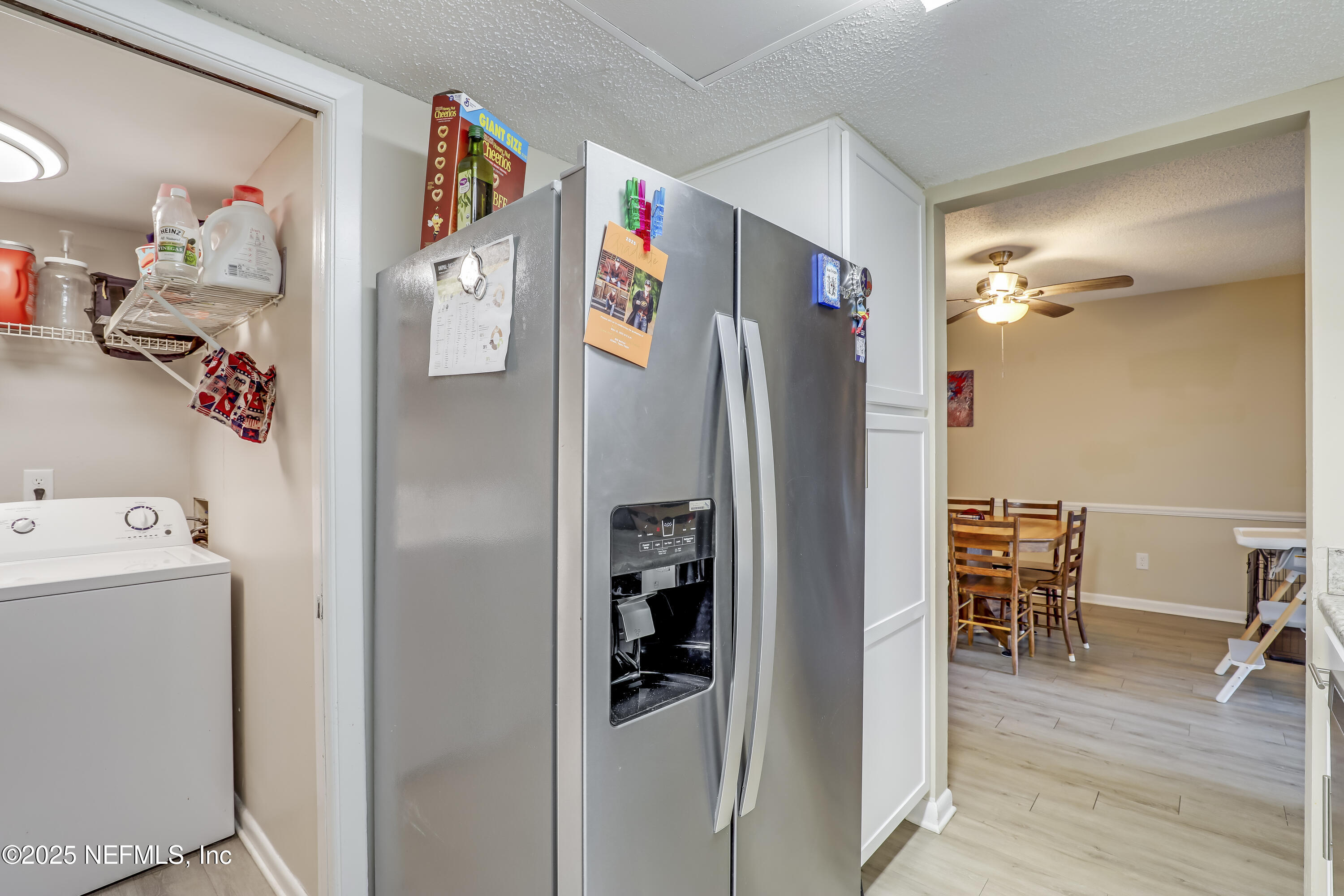 503 Kettering Way Orange Park, FL 32073 - Photo 15 of 28 a view of a kitchen with refrigerator and wooden floor