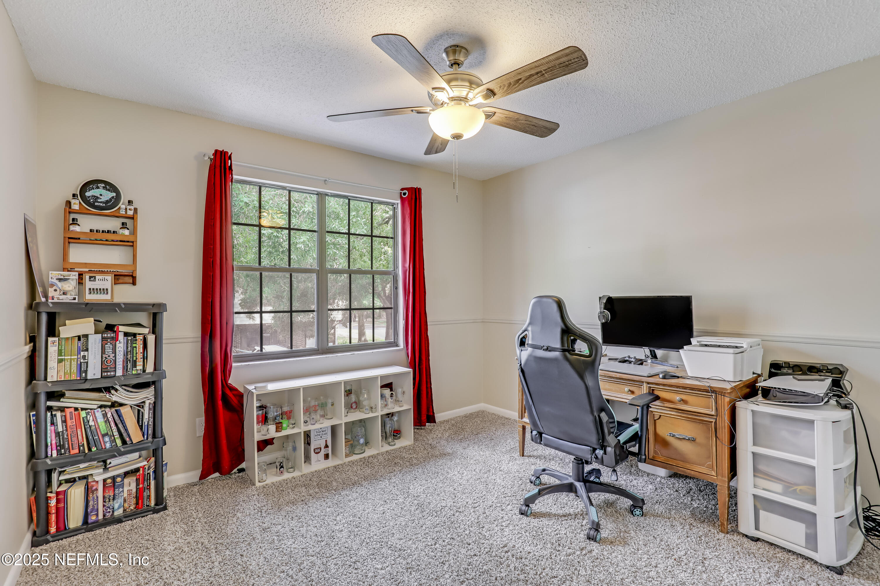 503 Kettering Way Orange Park, FL 32073 - Photo 18 of 28 a view of a workspace with furniture and a window