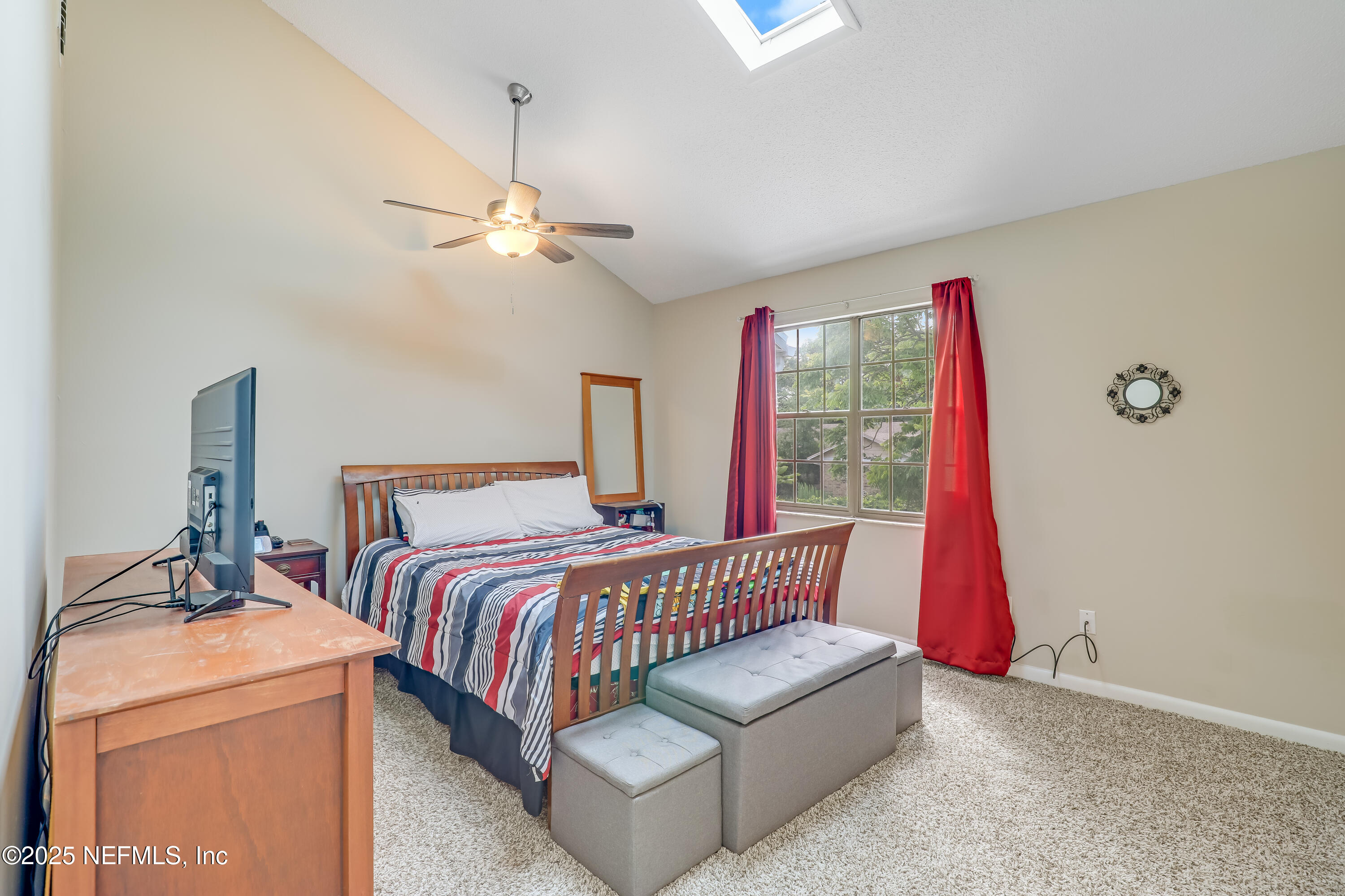 503 Kettering Way Orange Park, FL 32073 - Photo 2 of 28 a bedroom with a bed and a chandelier