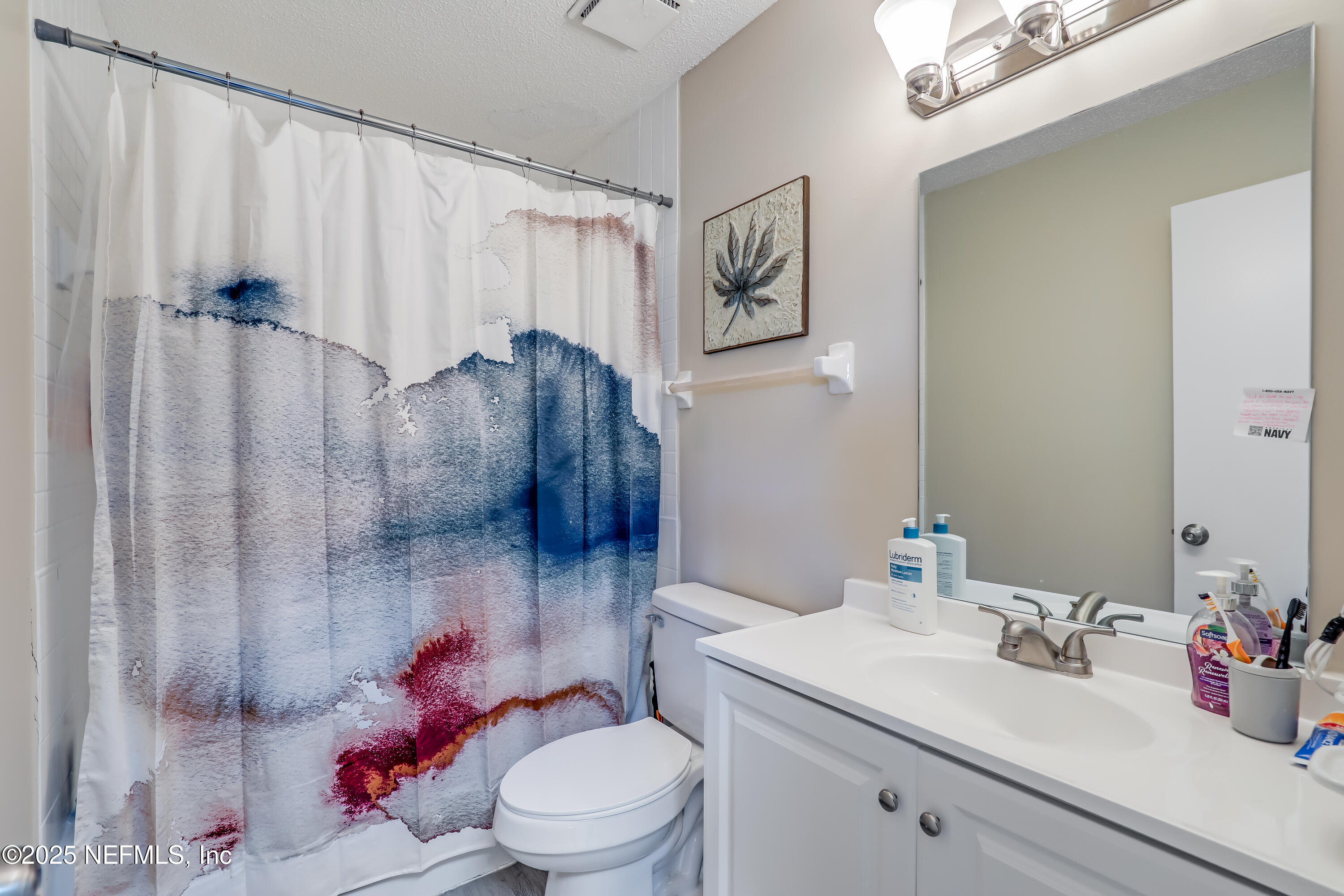 503 Kettering Way Orange Park, FL 32073 - Photo 24 of 28 a white toilet sitting next to a bathroom sink