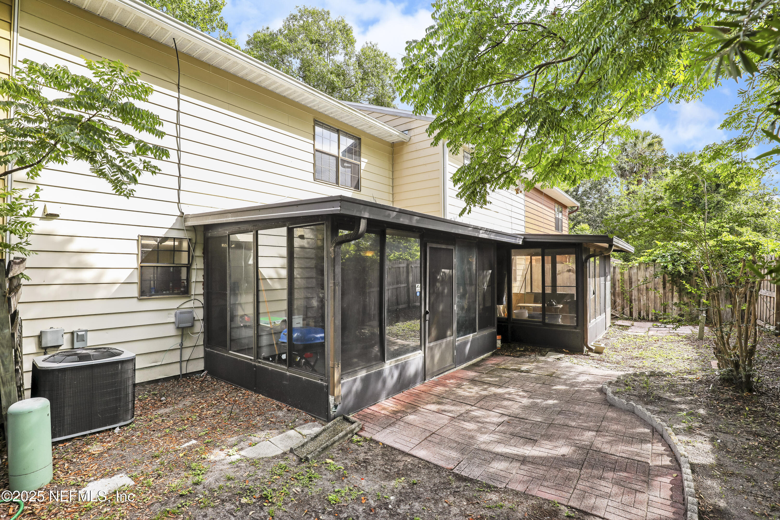 503 Kettering Way Orange Park, FL 32073 - Photo 27 of 28 a view of a house with a large window and wooden fence