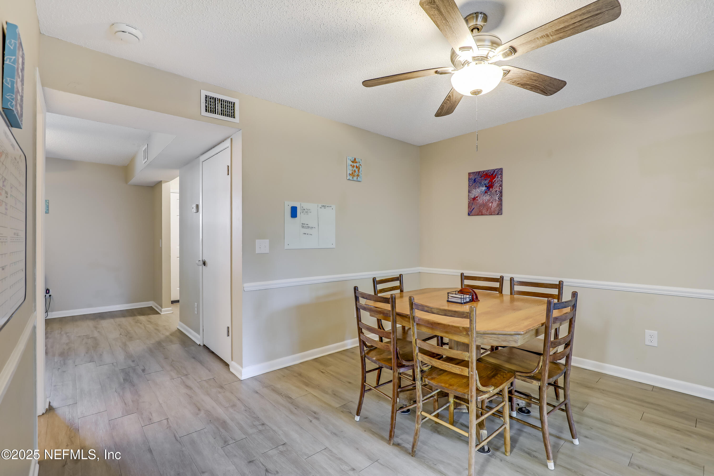 503 Kettering Way Orange Park, FL 32073 - Photo 4 of 28 a view of a dining room with furniture and wooden floor