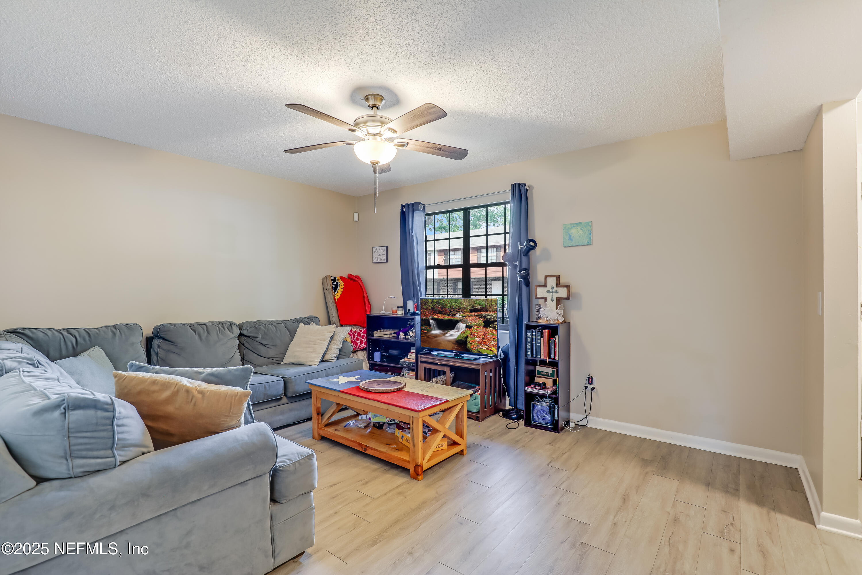 503 Kettering Way Orange Park, FL 32073 - Photo 5 of 28 a living room with furniture and a wooden floor